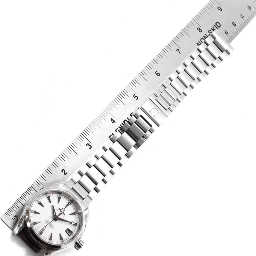 The image shows an Omega Aqua Terra 231.10.39.21.54.001 Men's Stainless Steel White Dial 231.10.39.21.54.001 Men's Stainless Steel White Dial watch, featuring its face and stainless steel bracelet, measured against a ruler.