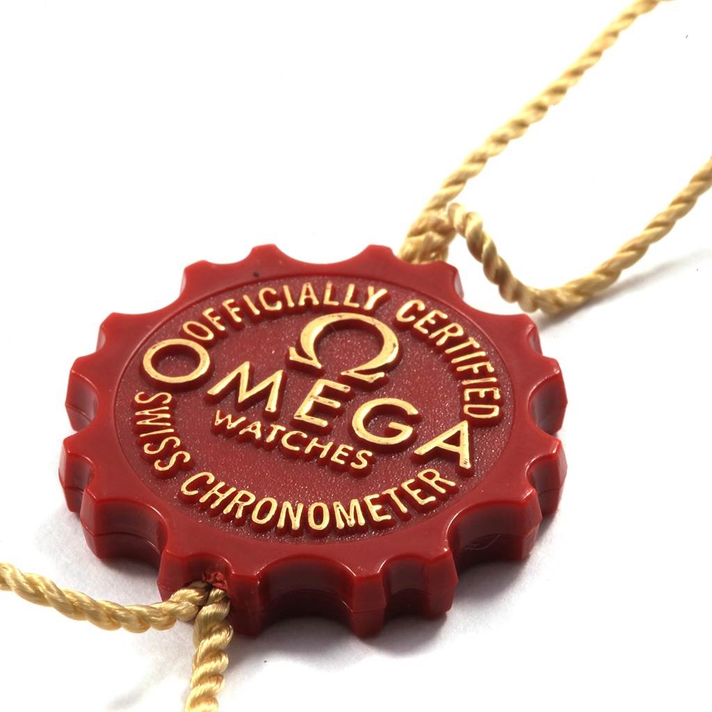 The image shows an Omega Aqua Terra 2502.80.00 Men's Stainless Steel Blue Dial 2502.80.00 Men's Stainless Steel Blue Dial model Swiss Chronometer certification tag from a top-down angle.