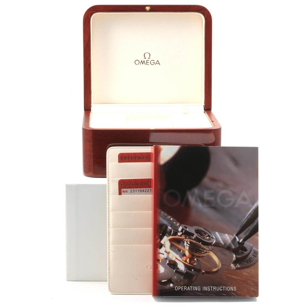 The image shows an Omega Aqua Terra 231.10.42.21.06.001 Men's Stainless Steel Grey Dial 231.10.42.21.06.001 Men's Stainless Steel Grey Dial watch box, with operating instructions and a cardholder both placed in front of the box.