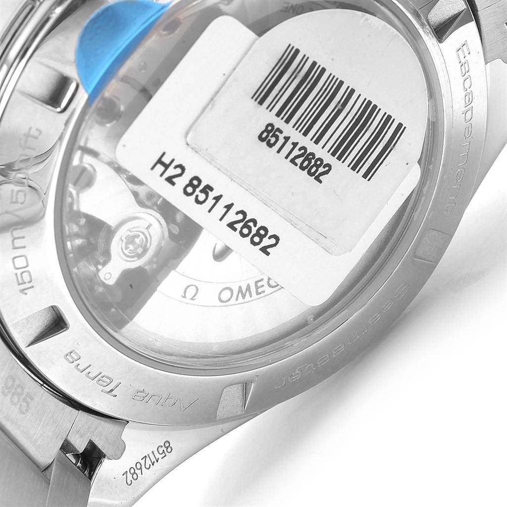 This image shows the back and inner mechanism of an Omega Aqua Terra 231.10.42.21.06.001 Men's Stainless Steel Grey Dial 231.10.42.21.06.001 Men's Stainless Steel Grey Dial watch with a barcode sticker on the case.