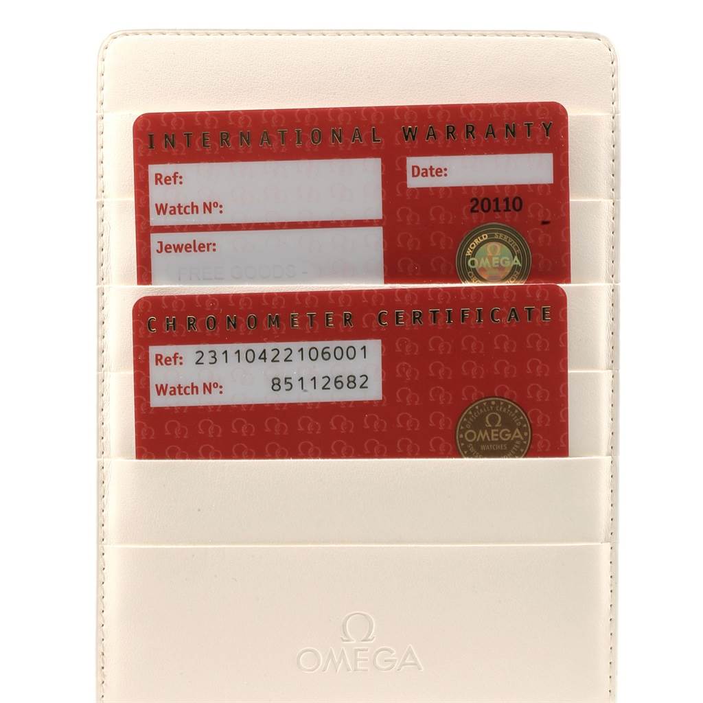 This image shows the Omega Aqua Terra 231.10.42.21.06.001 Men's Stainless Steel Grey Dial 231.10.42.21.06.001 Men's Stainless Steel Grey Dial model's warranty and chronometer certificate cards in a cream-colored holder.