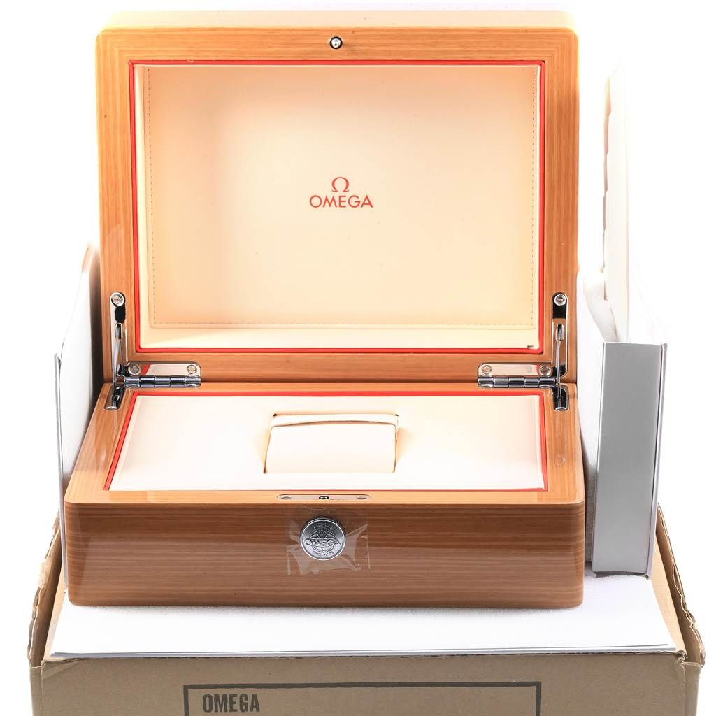 This image shows an open wooden case for the Omega Aqua Terra 231.10.39.21.03.002 Men's Stainless Steel Blue Dial 231.10.39.21.03.002 Men's Stainless Steel Blue Dial watch, highlighting the interior and branding.