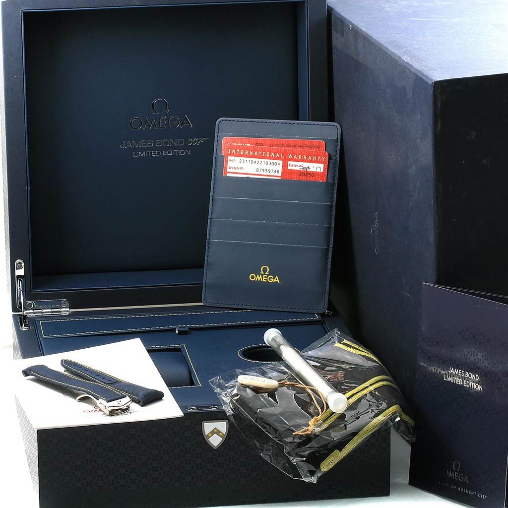 The image shows the packaging and accessories of the Omega Aqua Terra 231.10.42.21.03.004 Men's Stainless Steel Blue Dial 231.10.42.21.03.004 Men's Stainless Steel Blue Dial James Bond Limited Edition watch, including straps, warranty card, and case.