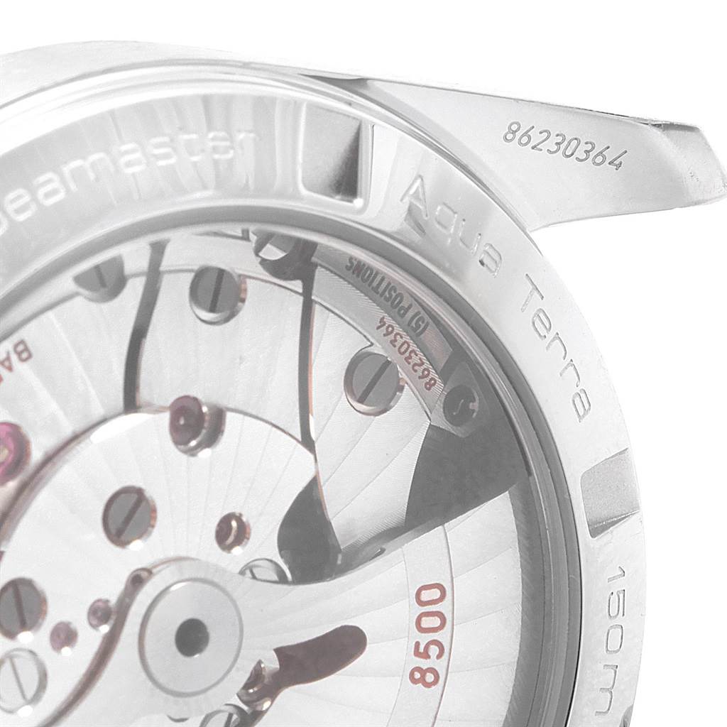 The image shows a close-up of the back side of the Omega Aqua Terra 231.10.39.21.03.001 Men
s Stainless Steel Blue Dial 231.10.39.21.03.001 Men
s Stainless Steel Blue Dial watch, highlighting the movement and serial numbers.