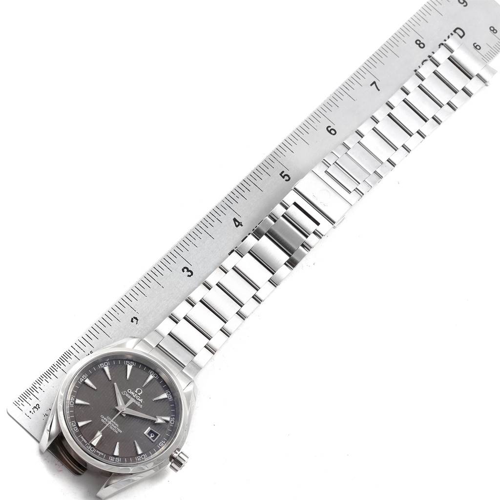 The image shows an Omega Aqua Terra 231.10.42.21.06.001 Men's Stainless Steel Grey Dial 231.10.42.21.06.001 Men's Stainless Steel Grey Dial watch laid flat with the face, band, and a ruler measuring the length.