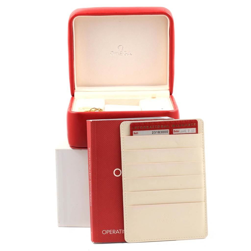 The image shows the Omega Aqua Terra 2318.30.00 Men
s Steel and Gold (two tone) Silver Dial 2318.30.00 Men
s Steel and Gold (two tone) Silver Dial model
s red watch box, operating instructions, and warranty card holder.