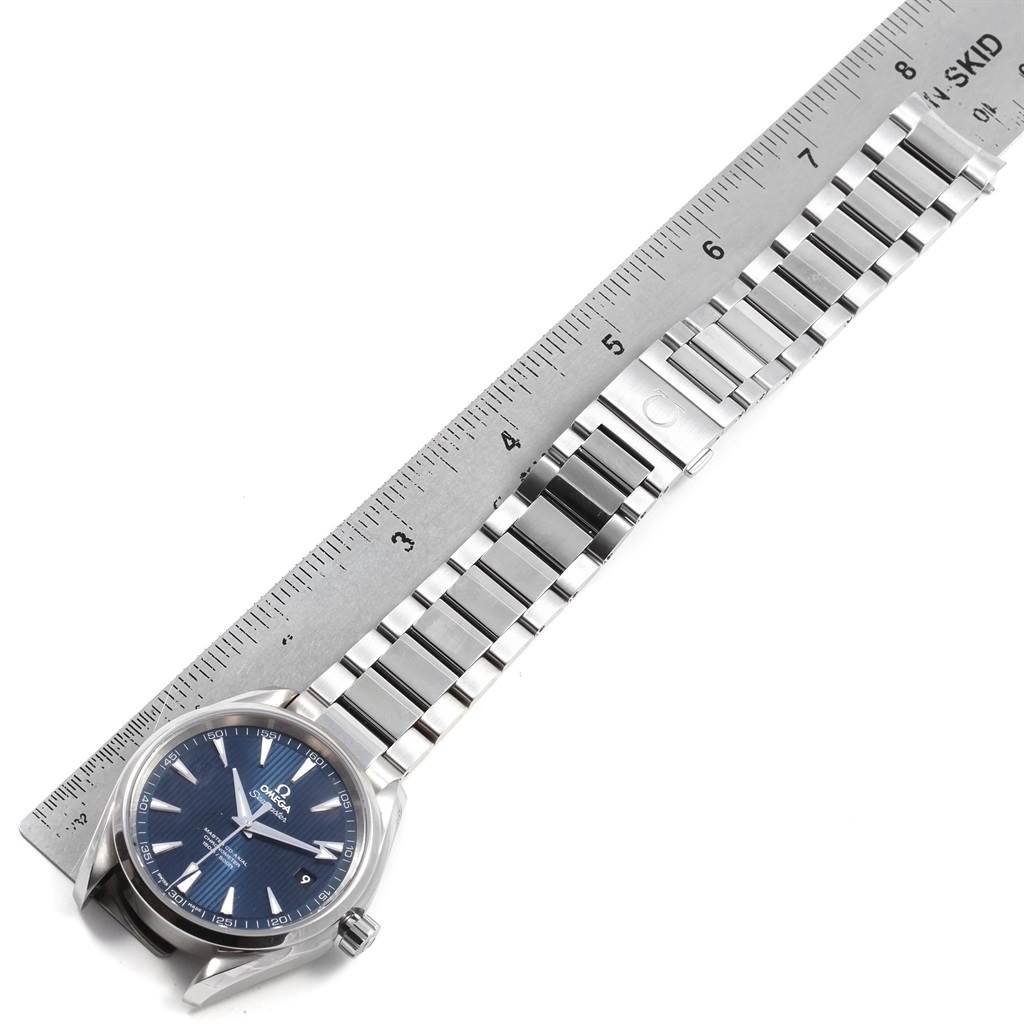 The image shows an Omega Aqua Terra 231.10.42.21.03.003 Men
s Stainless Steel Blue Dial 231.10.42.21.03.003 Men
s Stainless Steel Blue Dial watch laid flat with a ruler, displaying its blue dial and metal bracelet.