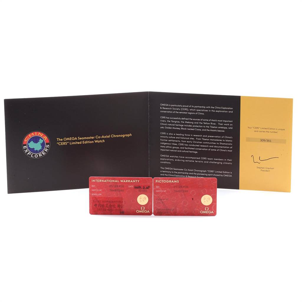 The image shows warranty and pictogram cards, and a folded manual for an Omega Seamaster Aqua Terra Limited Edition watch.