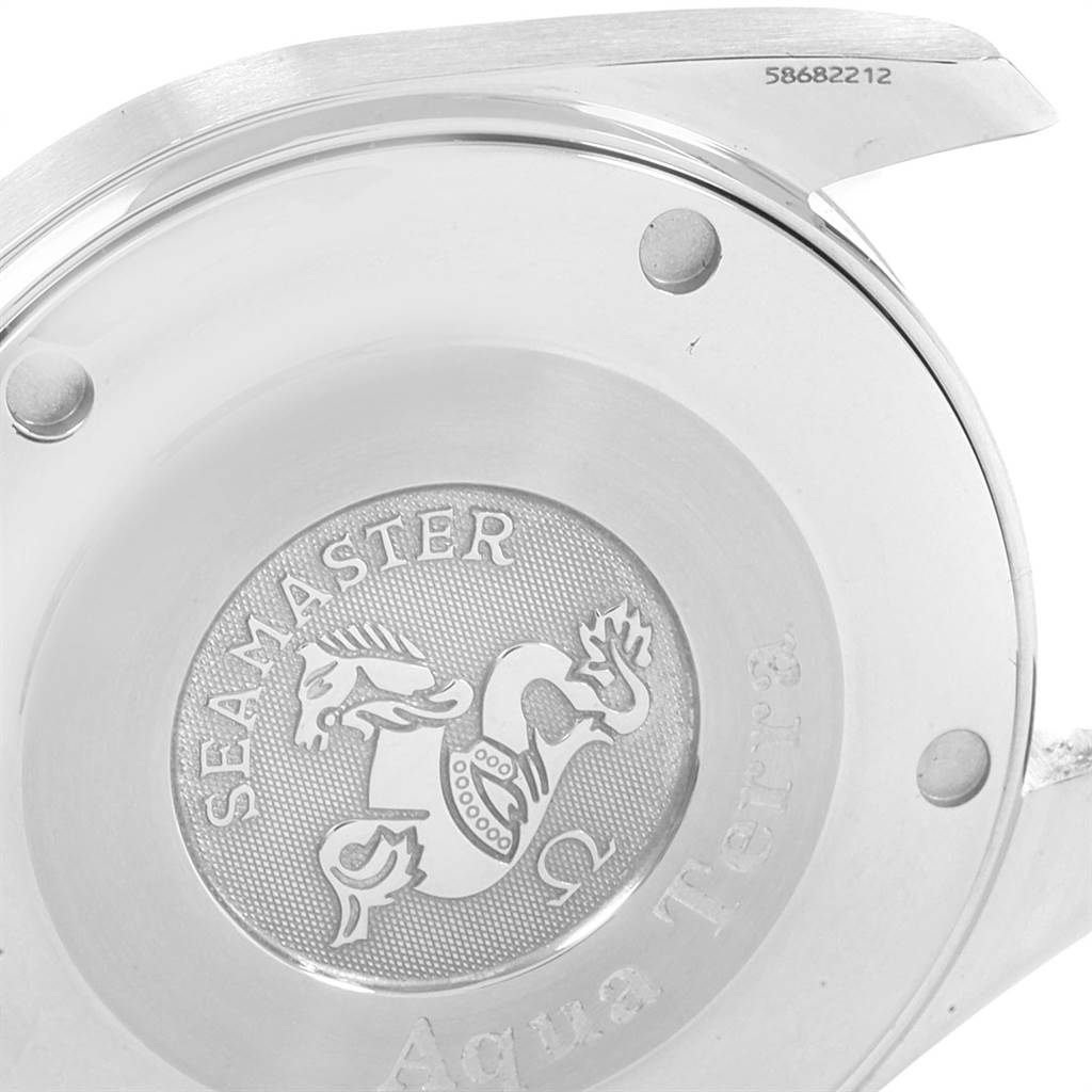 This image shows the backside of the Omega Aqua Terra 2317.30.00 Men
s Steel and Gold (two tone) Silver Dial 2317.30.00 Men
s Steel and Gold (two tone) Silver Dial Seamaster watch, highlighting the engraved medallion and serial number.