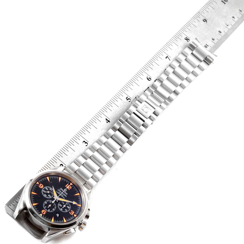 This image shows an overhead view of an Omega Aqua Terra 2512.54.00 Men's Stainless Steel Black Dial 2512.54.00 Men's Stainless Steel Black Dial watch, focusing on its face, band, and clasp next to a ruler.