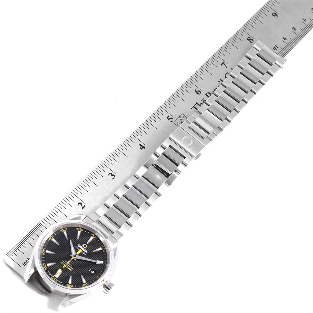 The Omega Aqua Terra 231.10.42.21.01.002 Men
s Stainless Steel Black Dial 231.10.42.21.01.002 Men
s Stainless Steel Black Dial watch is shown diagonally with its steel bracelet extended alongside a ruler.