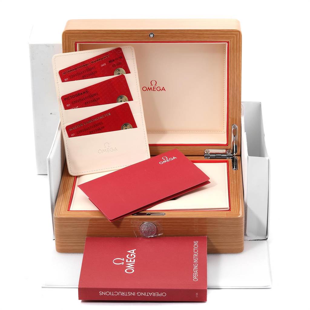 The image shows the packaging and accessories of the Omega Aqua Terra 220.10.41.21.03.001 Men's Stainless Steel Blue Dial 220.10.41.21.03.001 Men's Stainless Steel Blue Dial model, including the box, instruction manual, and warranty cards.