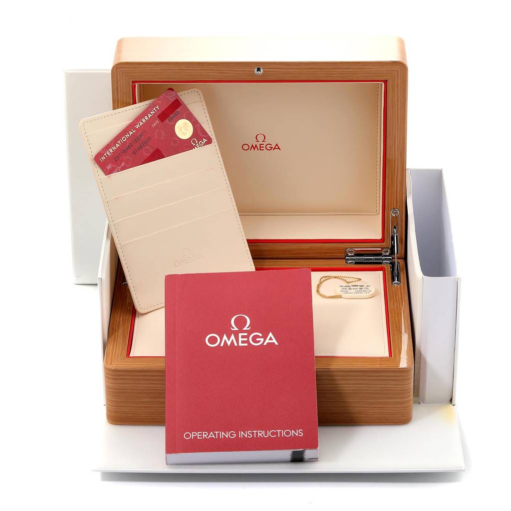 The image shows the packaging, international warranty card, and operating instructions for an Omega Aqua Terra 231.10.39.21.02.001 Men
s Stainless Steel Silver Dial 231.10.39.21.02.001 Men
s Stainless Steel Silver Dial watch.