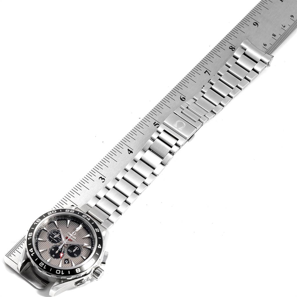 The Omega Aqua Terra 231.10.44.52.06.001 Men's Stainless Steel Grey Dial 231.10.44.52.06.001 Men's Stainless Steel Grey Dial watch is shown horizontally with a stainless steel bracelet and a ruler for measurement.