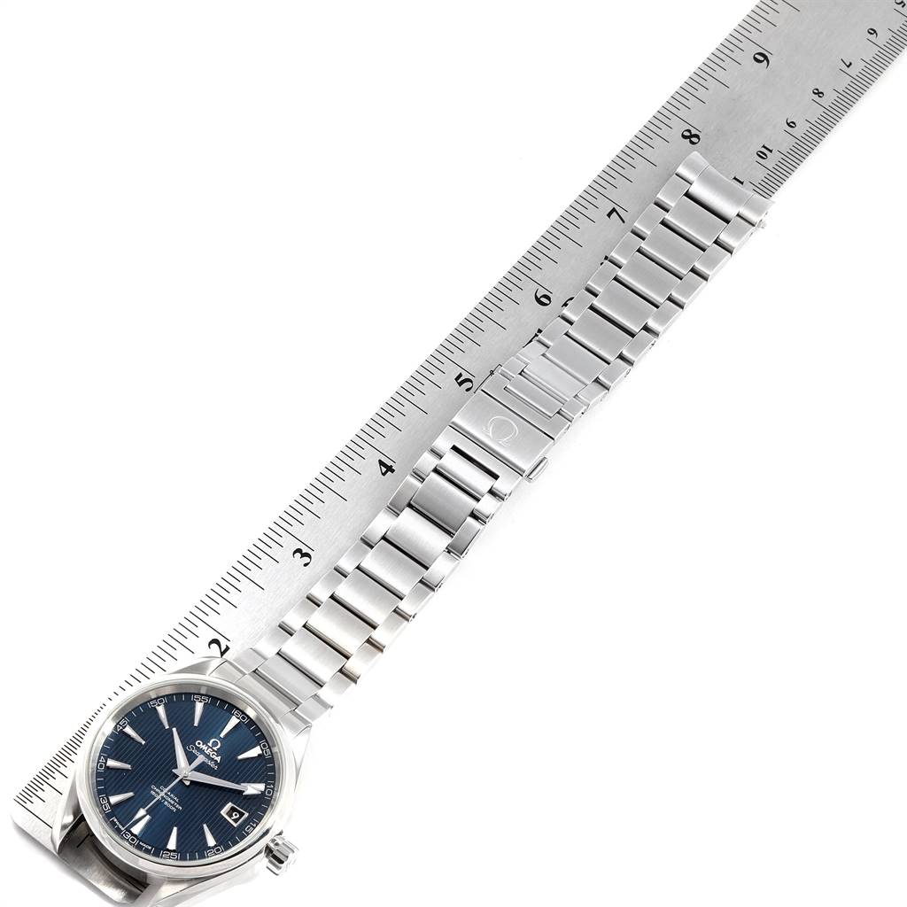 The image shows an Omega Aqua Terra 231.10.42.21.03.001 Men
s Stainless Steel Silver Dial 231.10.42.21.03.001 Men
s Stainless Steel Silver Dial watch laid flat with a stainless steel bracelet and a ruler measuring its length.