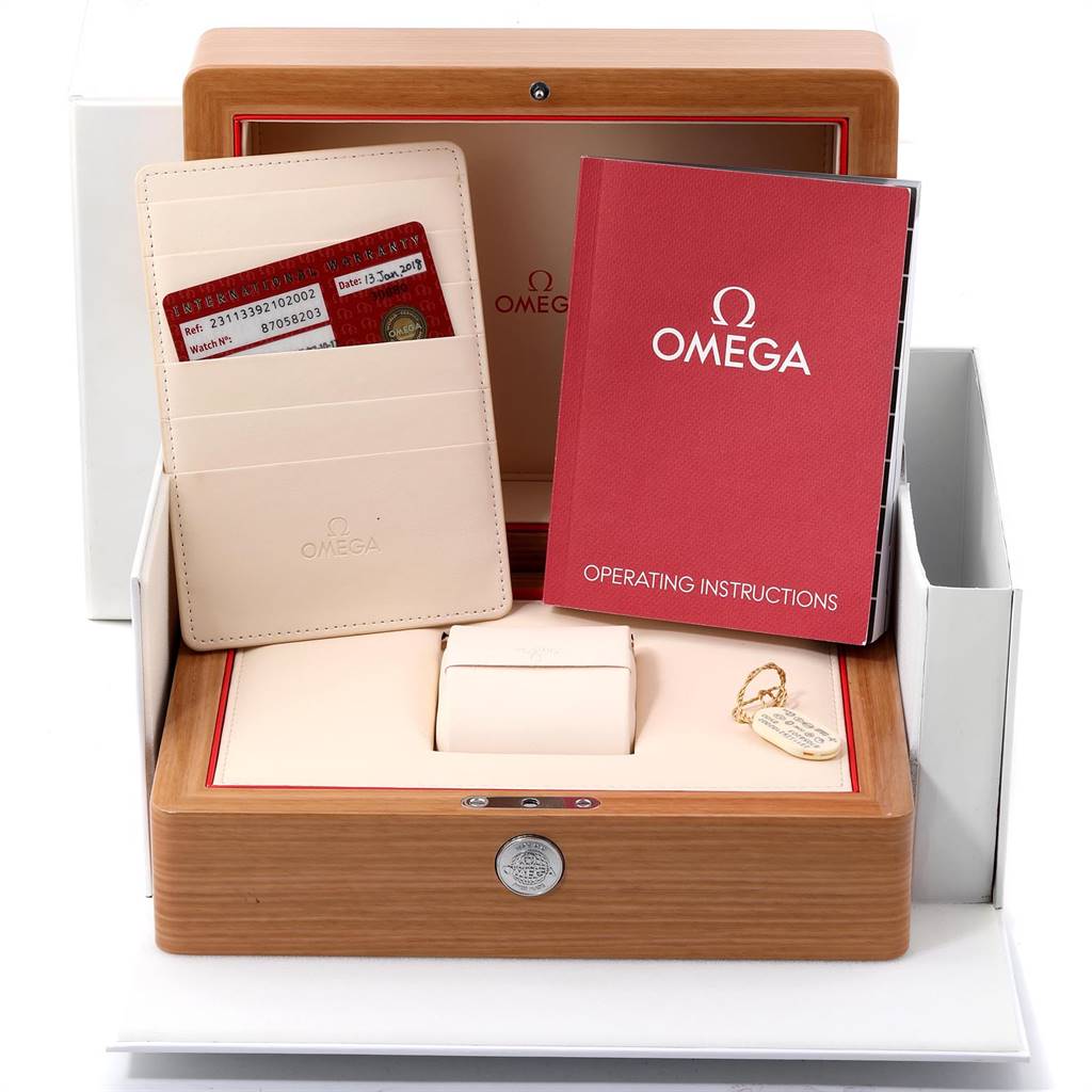 The image shows the packaging, warranty cards, operating instructions, and tag for the Omega Aqua Terra 231.13.39.21.02.002 Men
s Stainless Steel Silver Dial 231.13.39.21.02.002 Men
s Stainless Steel Silver Dial watch.