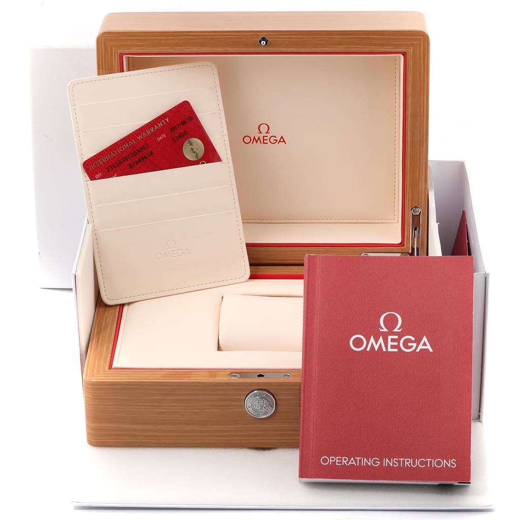 The image shows the box, warranty card, and operating instructions for the Omega Aqua Terra 231.10.39.21.03.002 Men
s Stainless Steel Blue Dial 231.10.39.21.03.002 Men
s Stainless Steel Blue Dial.