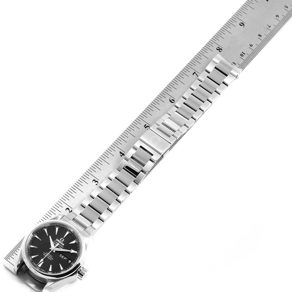 The image shows an Omega Aqua Terra 231.10.39.22.01.001 Men's Stainless Steel Black Dial 231.10.39.22.01.001 Men's Stainless Steel Black Dial watch laid flat, alongside a ruler, focusing on the bracelet and clasp.
