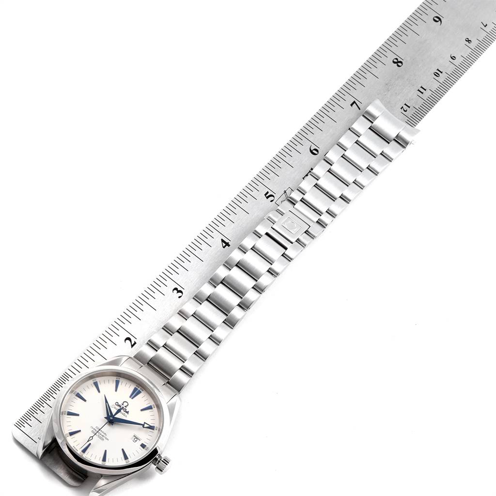 The image shows the face and bracelet of an Omega Aqua Terra 2503.33.00 Men
s Stainless Steel Silver Dial 2503.33.00 Men
s Stainless Steel Silver Dial watch, laid next to a ruler angled diagonally.