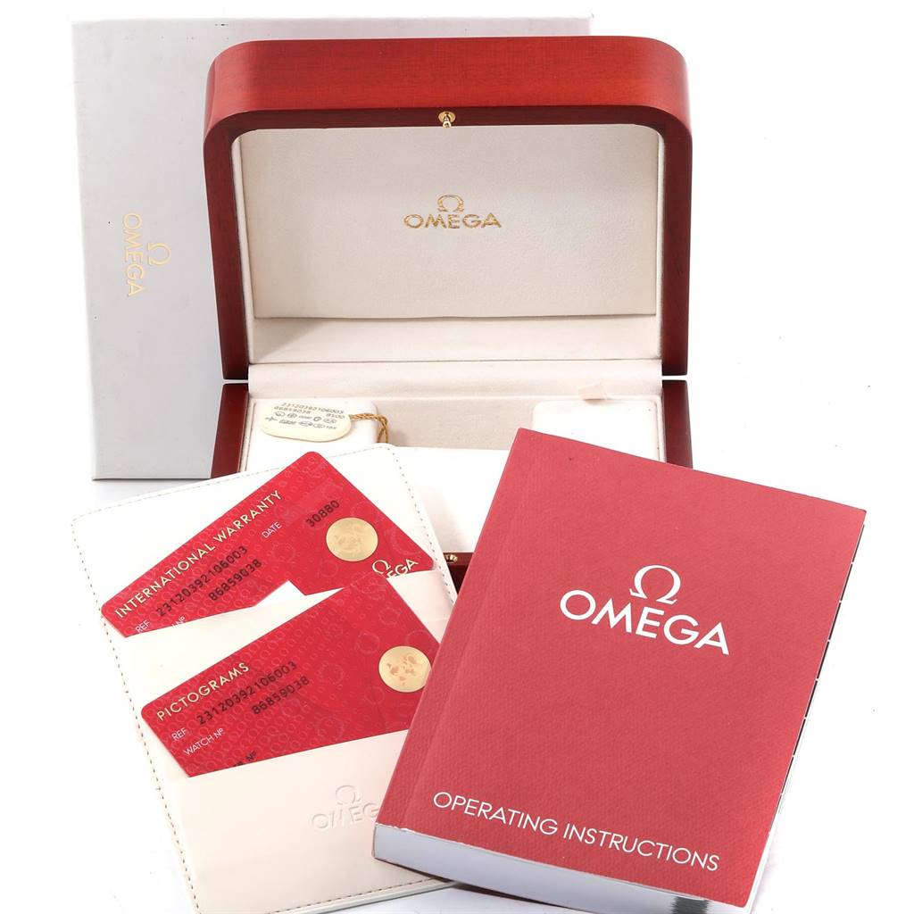 The image shows an open Omega box for an Aqua Terra model with warranty cards and operating instructions in front.