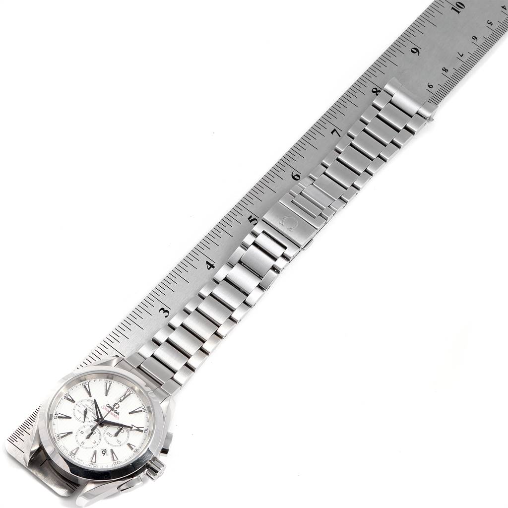 The image shows an Omega Aqua Terra 231.10.44.50.04.001 Men's Stainless Steel White Dial 231.10.44.50.04.001 Men's Stainless Steel White Dial watch lying flat with its bracelet and clasp extended along a ruler.