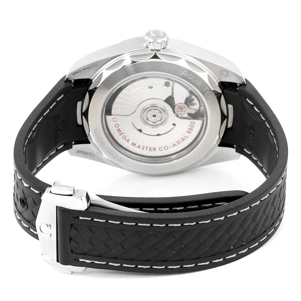 The image shows the back view of the Omega Aqua Terra 220.12.38.20.02.001 Men
s Stainless Steel Silver Dial 220.12.38.20.02.001 Men
s Stainless Steel Silver Dial watch, displaying its movement and part of the rubber strap with clasp.