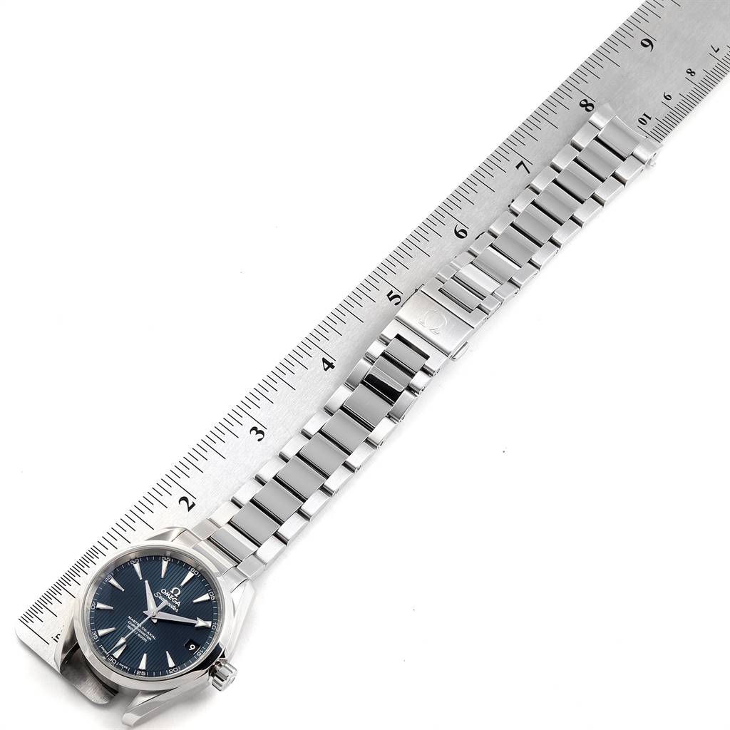 The image shows the face, case, and metal bracelet of the Omega Aqua Terra 231.10.39.21.03.002 Men
s Stainless Steel Blue Dial 231.10.39.21.03.002 Men
s Stainless Steel Blue Dial watch next to a ruler.