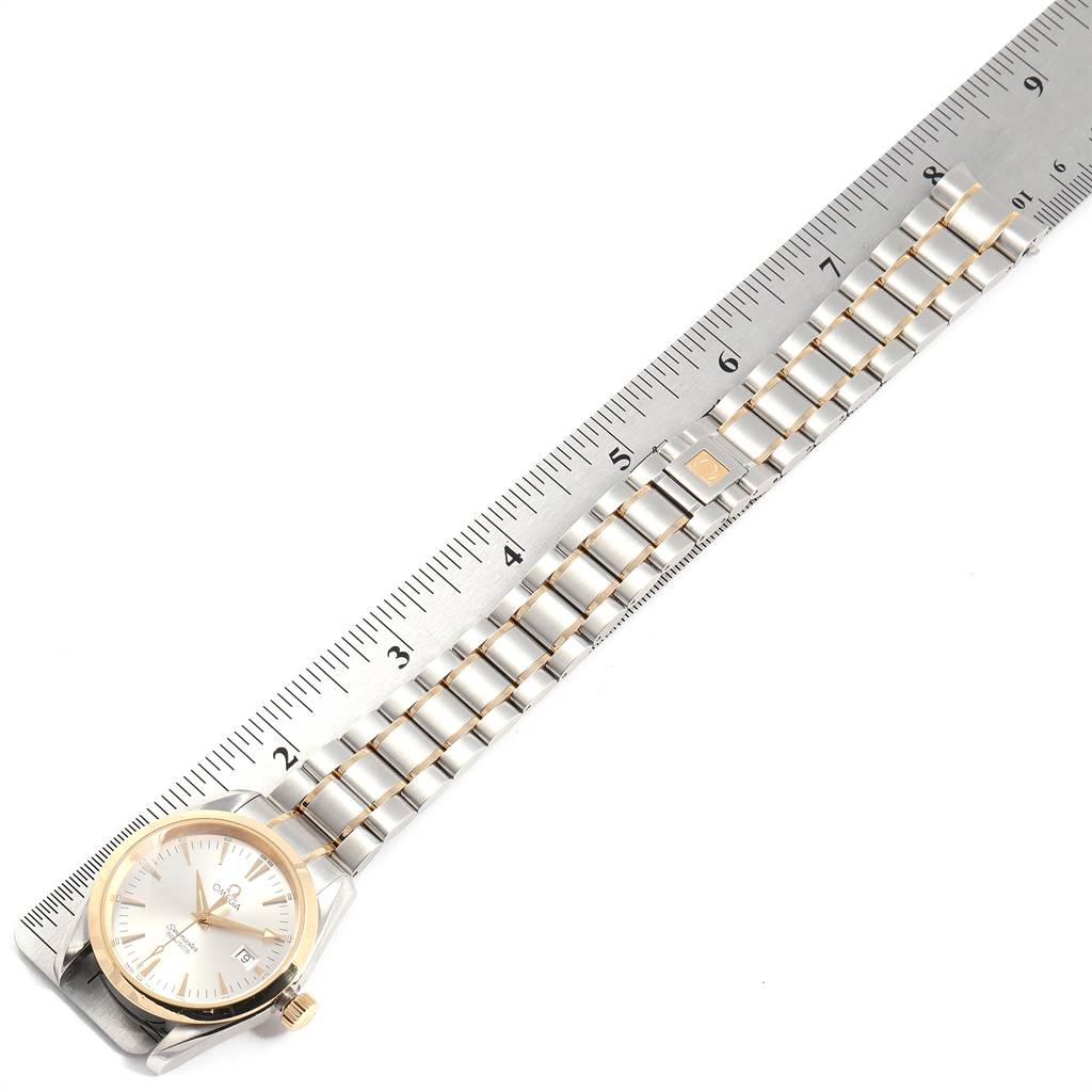 The image shows the Omega Aqua Terra 2318.30.00 Men
s Steel and Gold (two tone) Silver Dial 2318.30.00 Men
s Steel and Gold (two tone) Silver Dial watch from the top angle, highlighting the face, bracelet, and a ruler for size reference.