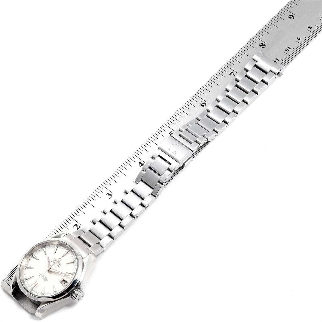 The Omega Aqua Terra 231.10.39.21.02.001 Men
s Stainless Steel Silver Dial 231.10.39.21.02.001 Men
s Stainless Steel Silver Dial watch is shown from an angle displaying its face and full metal bracelet, alongside a ruler for measurement.