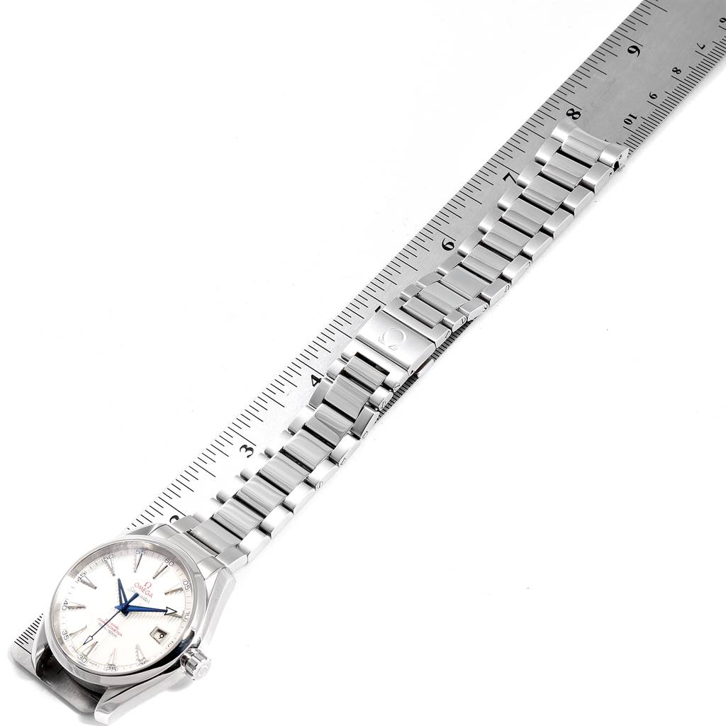 The image shows an Omega Aqua Terra 231.10.42.21.02.002 Men
s Stainless Steel Silver Dial 231.10.42.21.02.002 Men
s Stainless Steel Silver Dial watch at an angle displaying its face, bracelet, and clasp, with a ruler for scale.