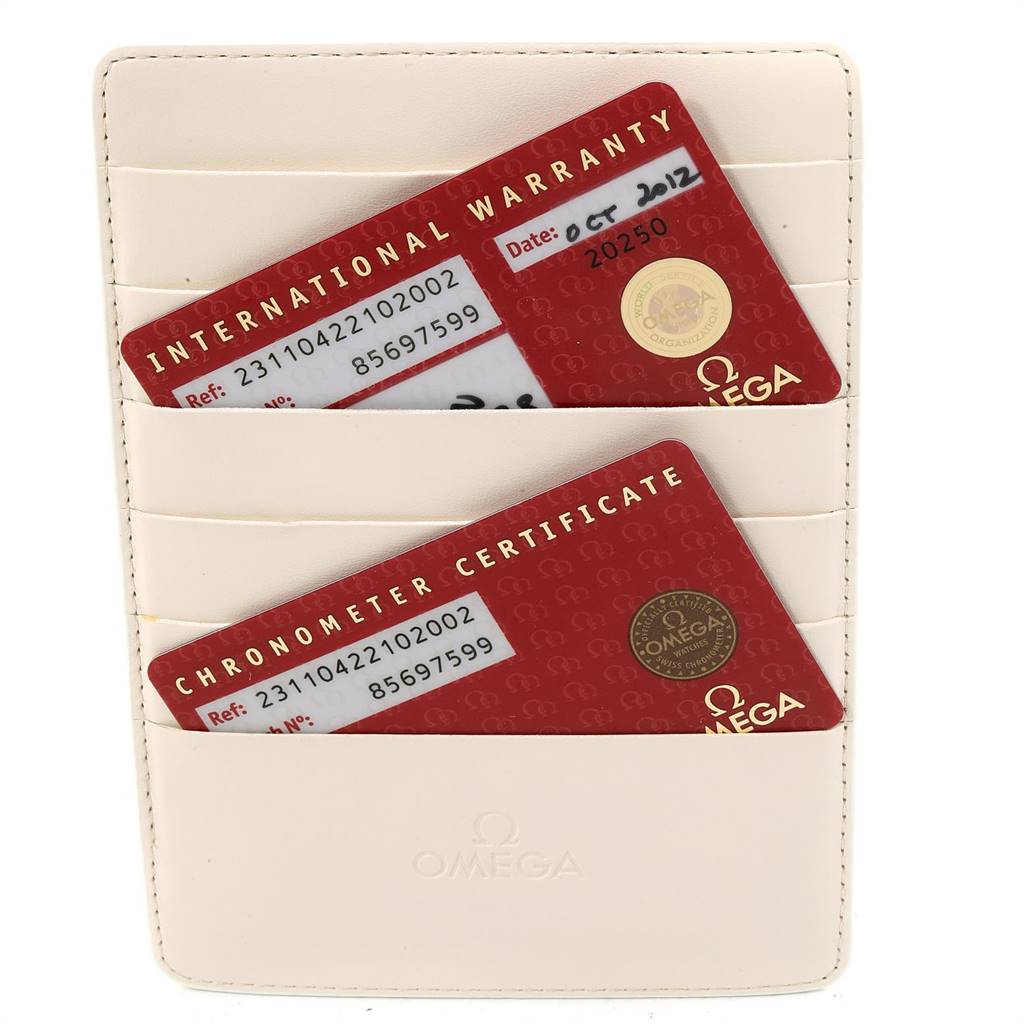 The image shows the International Warranty and Chronometer Certificate cards for an Omega Aqua Terra 231.10.42.21.02.002 Men
s Stainless Steel Silver Dial 231.10.42.21.02.002 Men
s Stainless Steel Silver Dial watch in a cream cardholder.