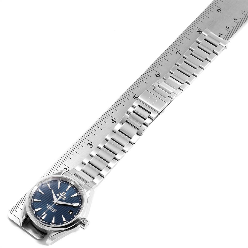 The Omega Aqua Terra 231.10.42.21.03.003 Men
s Stainless Steel Blue Dial 231.10.42.21.03.003 Men
s Stainless Steel Blue Dial watch is shown from an angled top-down view, highlighting its face and stainless steel bracelet alongside a ruler.