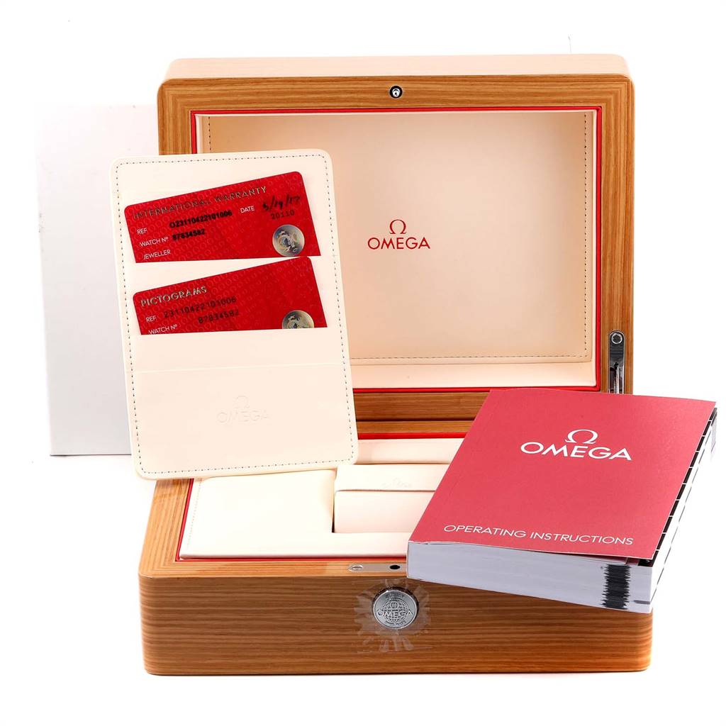 The image shows the Aqua Terra Omega watch box, warranty cards, and operating instructions.