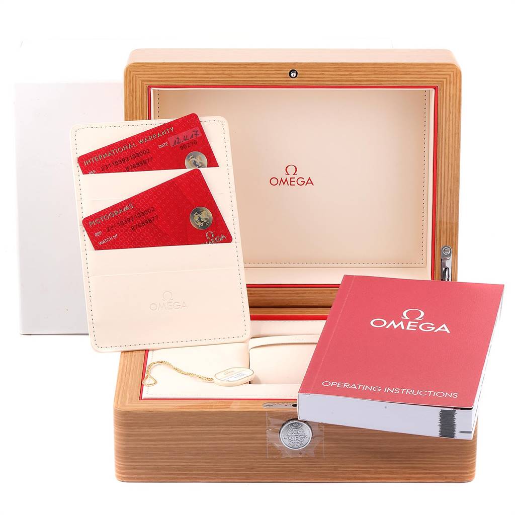 The image shows the packaging accessories for an Omega Aqua Terra 231.10.39.21.03.002 Men
s Stainless Steel Blue Dial 231.10.39.21.03.002 Men
s Stainless Steel Blue Dial watch, including the storage box, instruction manual, and warranty cards.