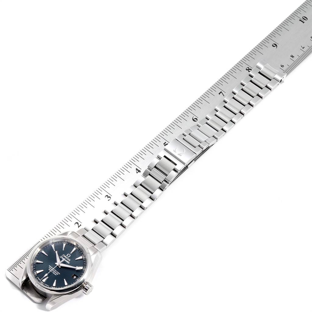 The image shows an Omega Aqua Terra 231.10.39.21.03.002 Men
s Stainless Steel Blue Dial 231.10.39.21.03.002 Men
s Stainless Steel Blue Dial watch laying flat with its bracelet extended alongside a ruler.