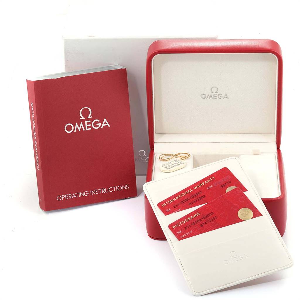 The image shows the packaging and accessories of the Omega Aqua Terra 231.10.39.21.03.002 Men
s Stainless Steel Blue Dial 231.10.39.21.03.002 Men
s Stainless Steel Blue Dial model, including the operating instructions, warranty cards, and the watch box.