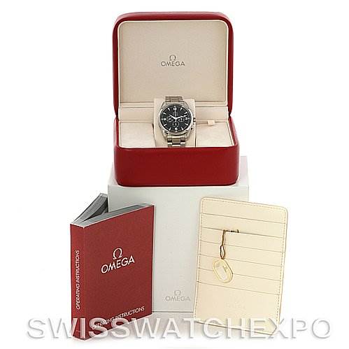 The image shows an Omega Aqua Terra 2512.52 Men
s Stainless Steel Black Dial 2512.52 Men
s Stainless Steel Black Dial watch in its box, accompanied by the user manual and warranty card holder with a keychain.