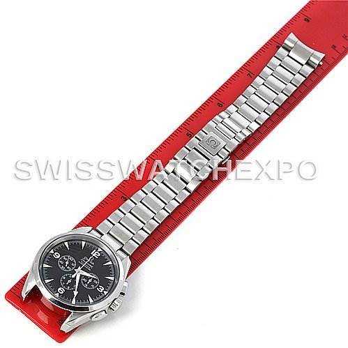 The image shows an Omega Aqua Terra 2512.52 Men
s Stainless Steel Black Dial 2512.52 Men
s Stainless Steel Black Dial watch laid flat on a red ruler, displaying its face and metal bracelet.