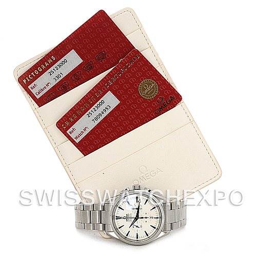 The image shows an Omega Aqua Terra 2512.30 Men
s Stainless Steel Silver Dial 2512.30 Men
s Stainless Steel Silver Dial watch with a stainless steel bracelet, along with two red Omega warranty cards and a white cardholder.