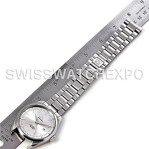 The image displays an Omega Aqua Terra 2502.30.00 Men's Stainless Steel Silver Dial 2502.30.00 Men's Stainless Steel Silver Dial watch laid flat alongside a ruler, showcasing its dial and bracelet.