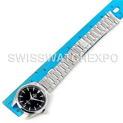 The Omega Aqua Terra 2502.50.00 Men's Stainless Steel Black Dial 2502.50.00 Men's Stainless Steel Black Dial watch is shown from a top-down angle with its full bracelet alongside a blue ruler.