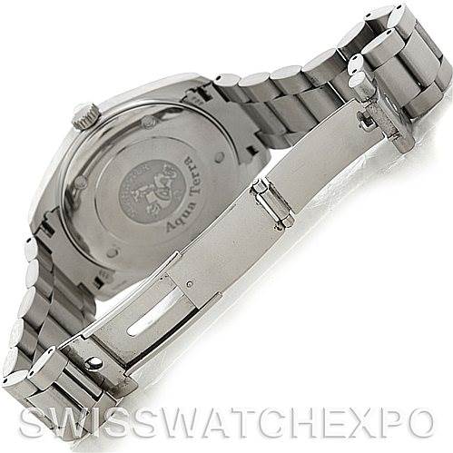 The image shows the backside of an Omega Aqua Terra 2517.50.00 Men
s Stainless Steel Black Dial 2517.50.00 Men
s Stainless Steel Black Dial watch, focusing on the case back and partially open stainless steel bracelet.