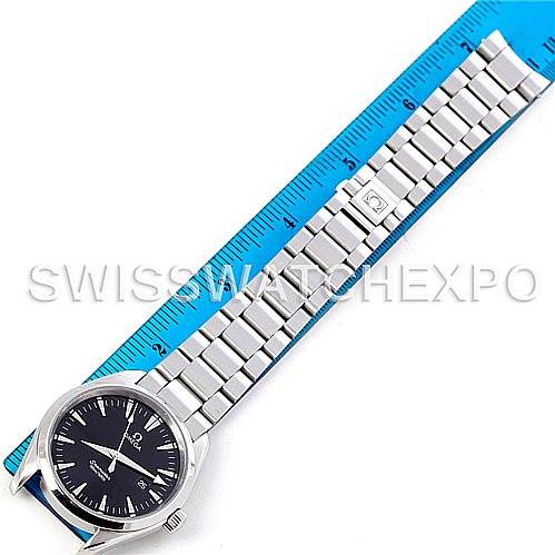 The image shows an Omega Aqua Terra 2517.50.00 Men
s Stainless Steel Black Dial 2517.50.00 Men
s Stainless Steel Black Dial watch in a top-down angle, highlighting its face, bracelet, and clasp next to a blue ruler.