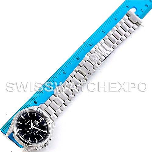 The Omega Aqua Terra 2512.50.00 Men
s Stainless Steel Black Dial 2512.50.00 Men
s Stainless Steel Black Dial watch is displayed flat alongside a blue ruler, showing the face, bracelet, and clasp.