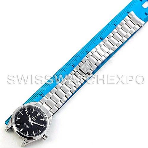 The image shows an Omega Aqua Terra 2503.50.000 Men
s Stainless Steel Black Dial 2503.50.000 Men
s Stainless Steel Black Dial watch laid flat with its bracelet extended next to a blue ruler.