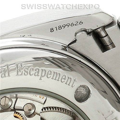 The image shows a close-up angled view of the back of an Omega Aqua Terra 2503.52.00 Men
s Stainless Steel Black Dial 2503.52.00 Men
s Stainless Steel Black Dial watch, highlighting its serial number and part of the mechanical movement.