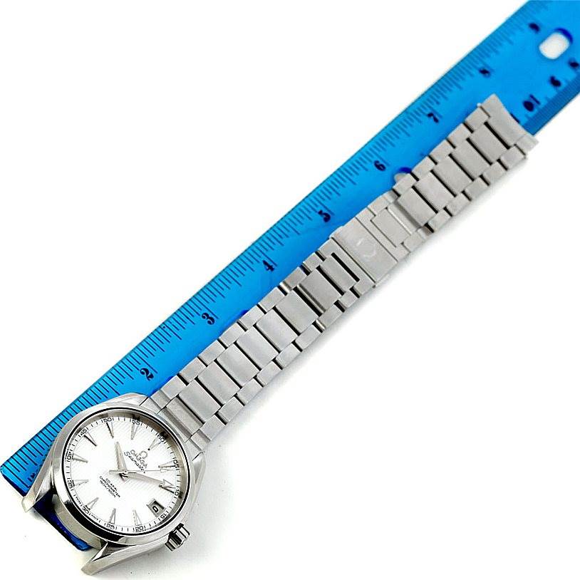 The Omega Aqua Terra 231.10.39.21.02.001 Men
s Stainless Steel Silver Dial 231.10.39.21.02.001 Men
s Stainless Steel Silver Dial watch is shown from an overhead angle with a ruler measuring its bracelet.