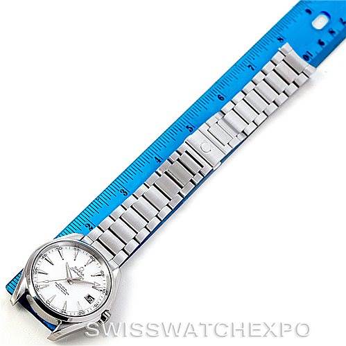 The Omega Aqua Terra 231.10.42.21.02.001 Men
s Stainless Steel Silver Dial 231.10.42.21.02.001 Men
s Stainless Steel Silver Dial watch is shown from above, displaying its face, bracelet, and clasp beside a blue ruler for scale.