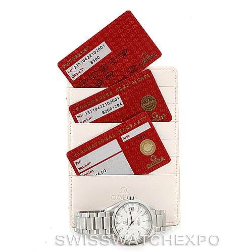The image shows an Omega Aqua Terra 231.10.42.21.02.001 Men
s Stainless Steel Silver Dial 231.10.42.21.02.001 Men
s Stainless Steel Silver Dial watch with its band and a white dial, accompanied by three red certification cards displayed at an angle.