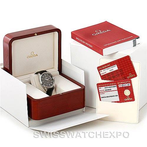 The image shows an Omega Aqua Terra 231.13.42.21.06.001 Men
s Stainless Steel Grey Dial 231.13.42.21.06.001 Men
s Stainless Steel Grey Dial watch in its open box, along with warranty cards and a manual.